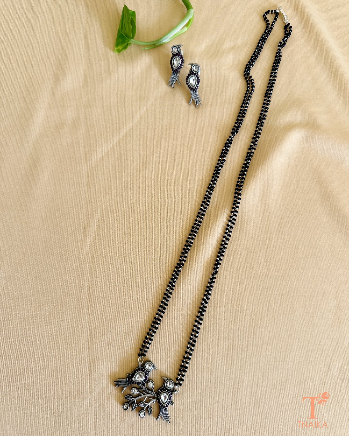 Traditional oxidised mangalsutra with bird design and black beaded chain