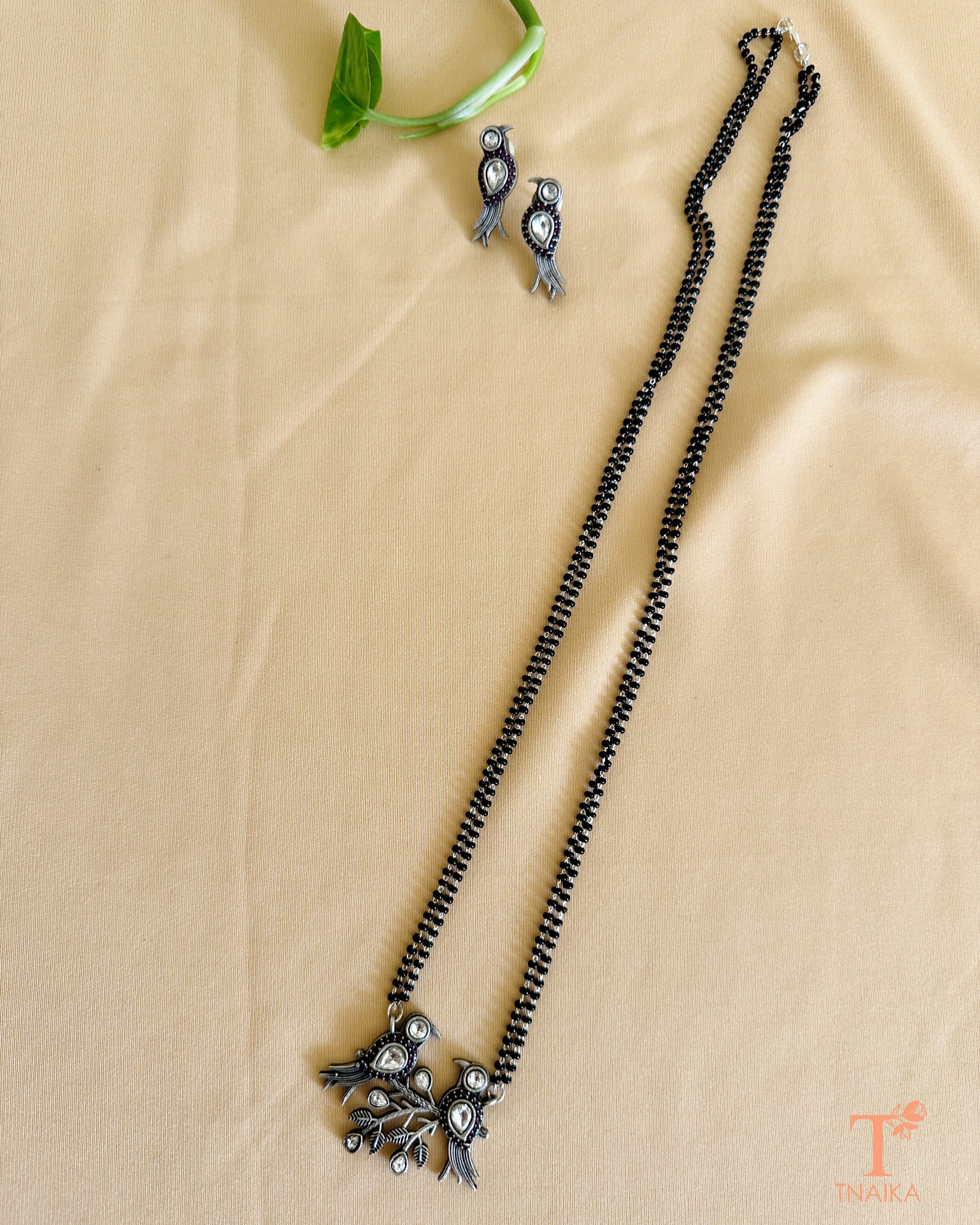 Traditional oxidised mangalsutra with bird design and black beaded chain