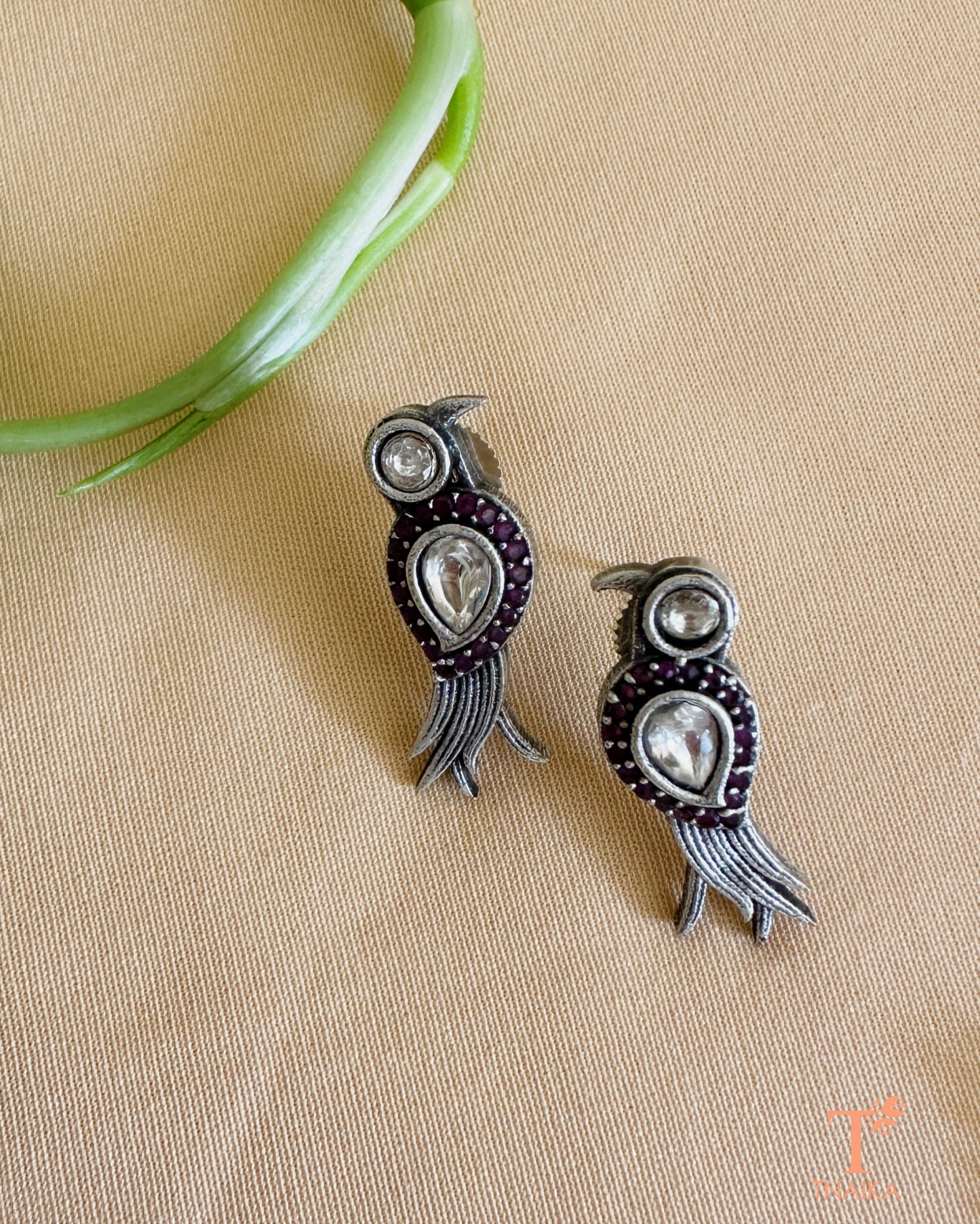 Close-up of oxidised bird pendant mangalsutra adorned with shimmering stones