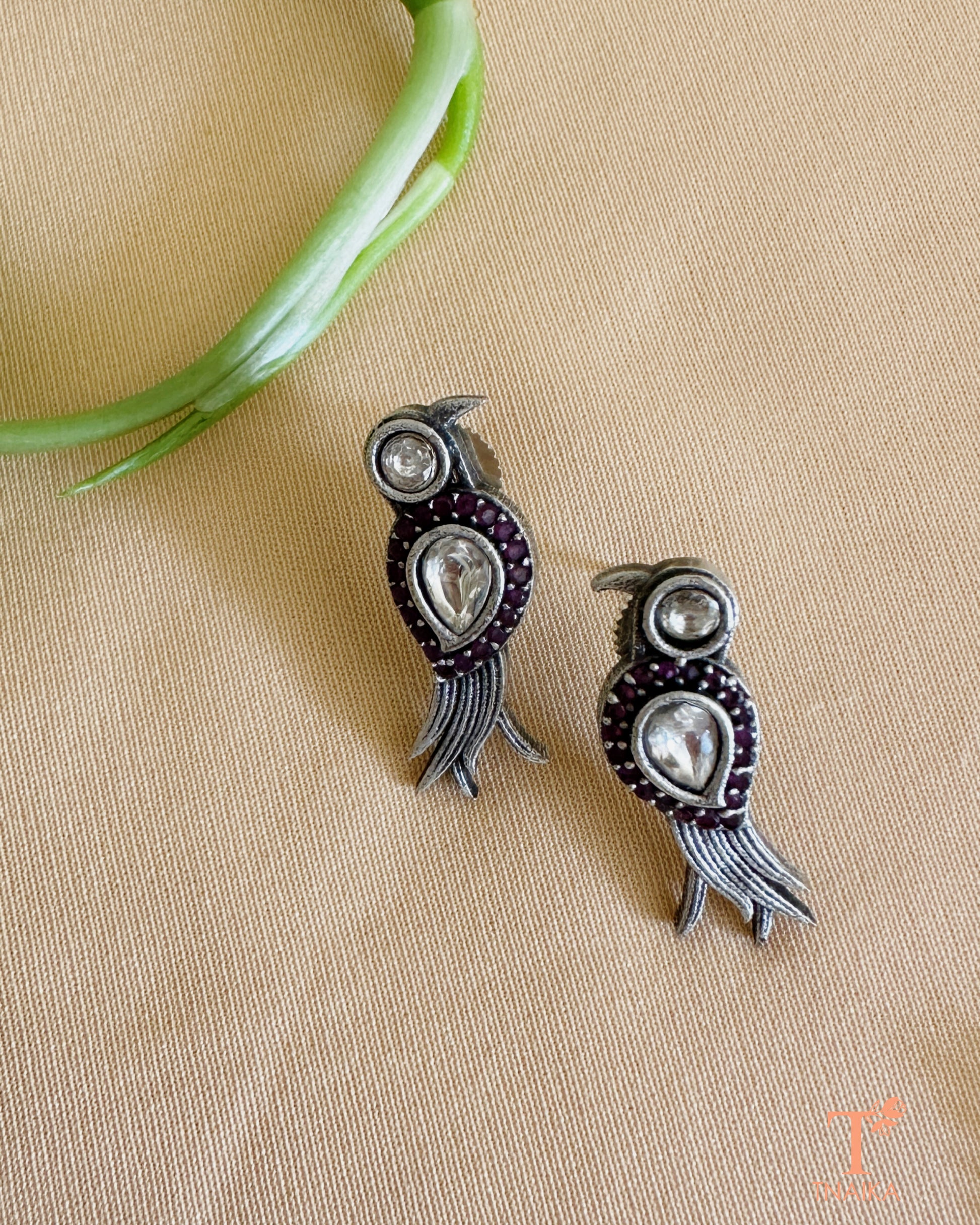 Close-up of oxidised bird pendant mangalsutra adorned with shimmering stones