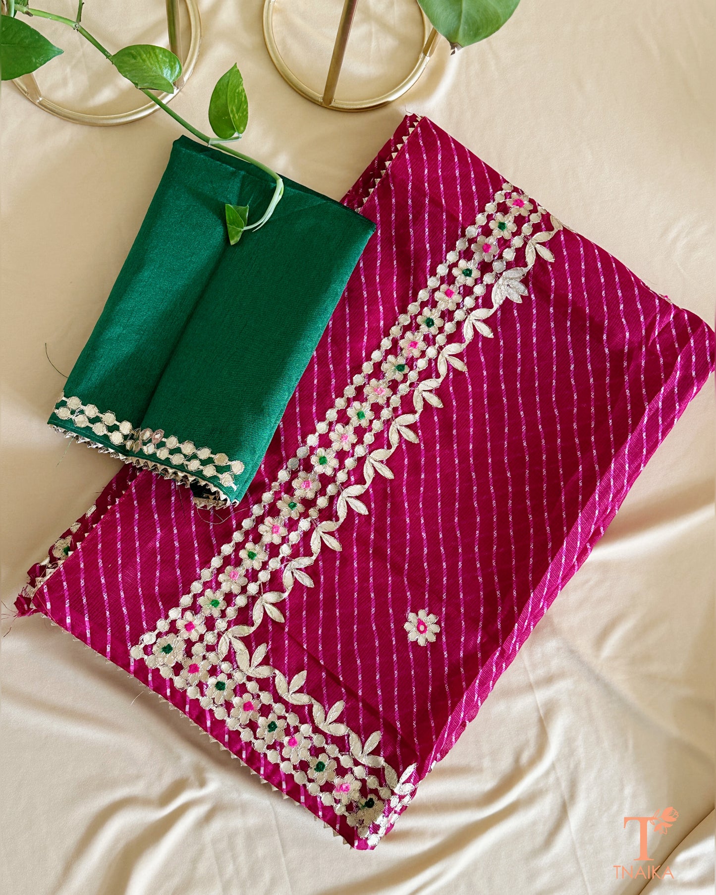 Lightweight Kota Doria saree in vibrant wine with exquisite handcrafted Gotta Patti embellishments.