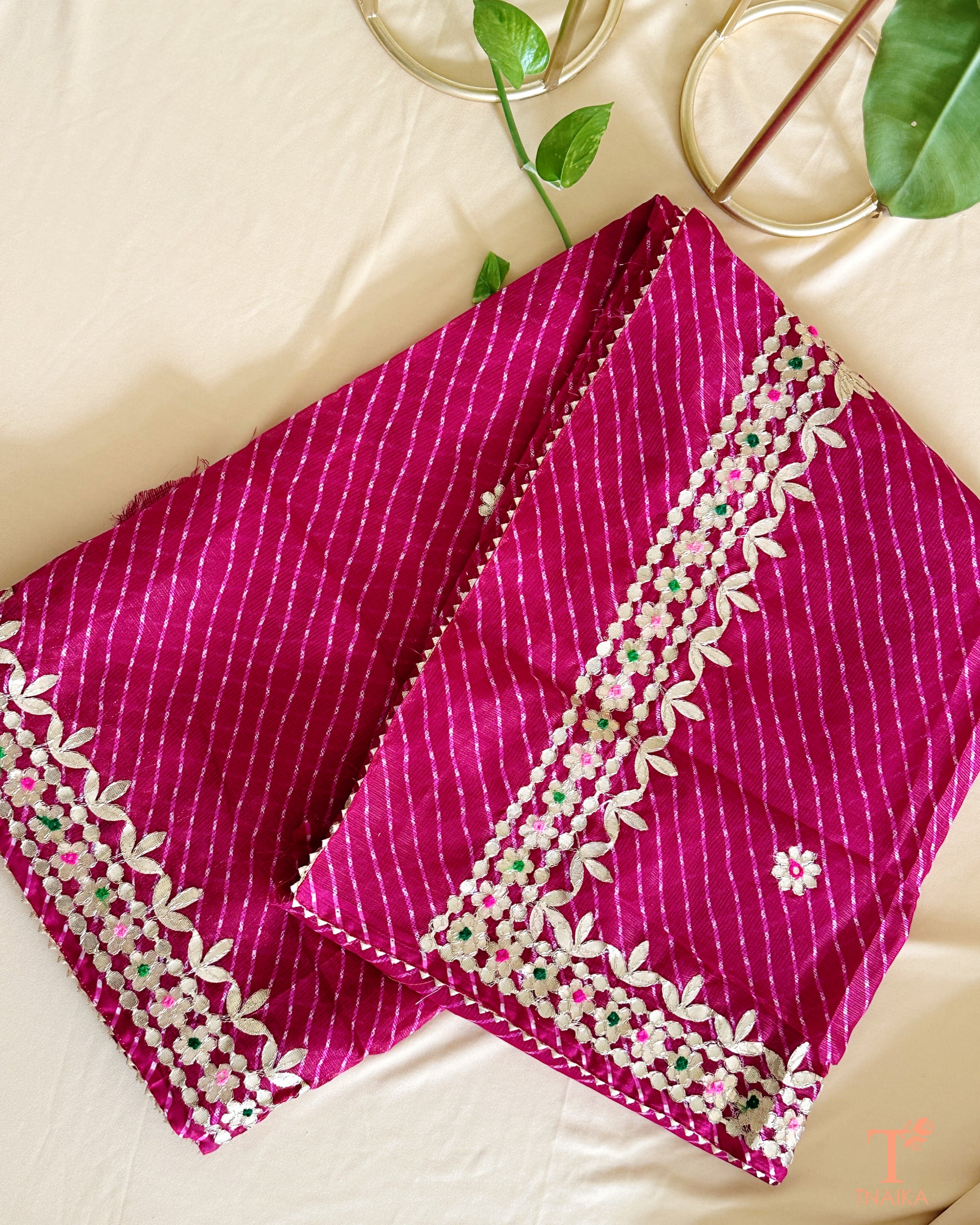 Elegant wine Kota Doria Gotta Patti saree with shimmering golden accents and delicate craftsmanship.