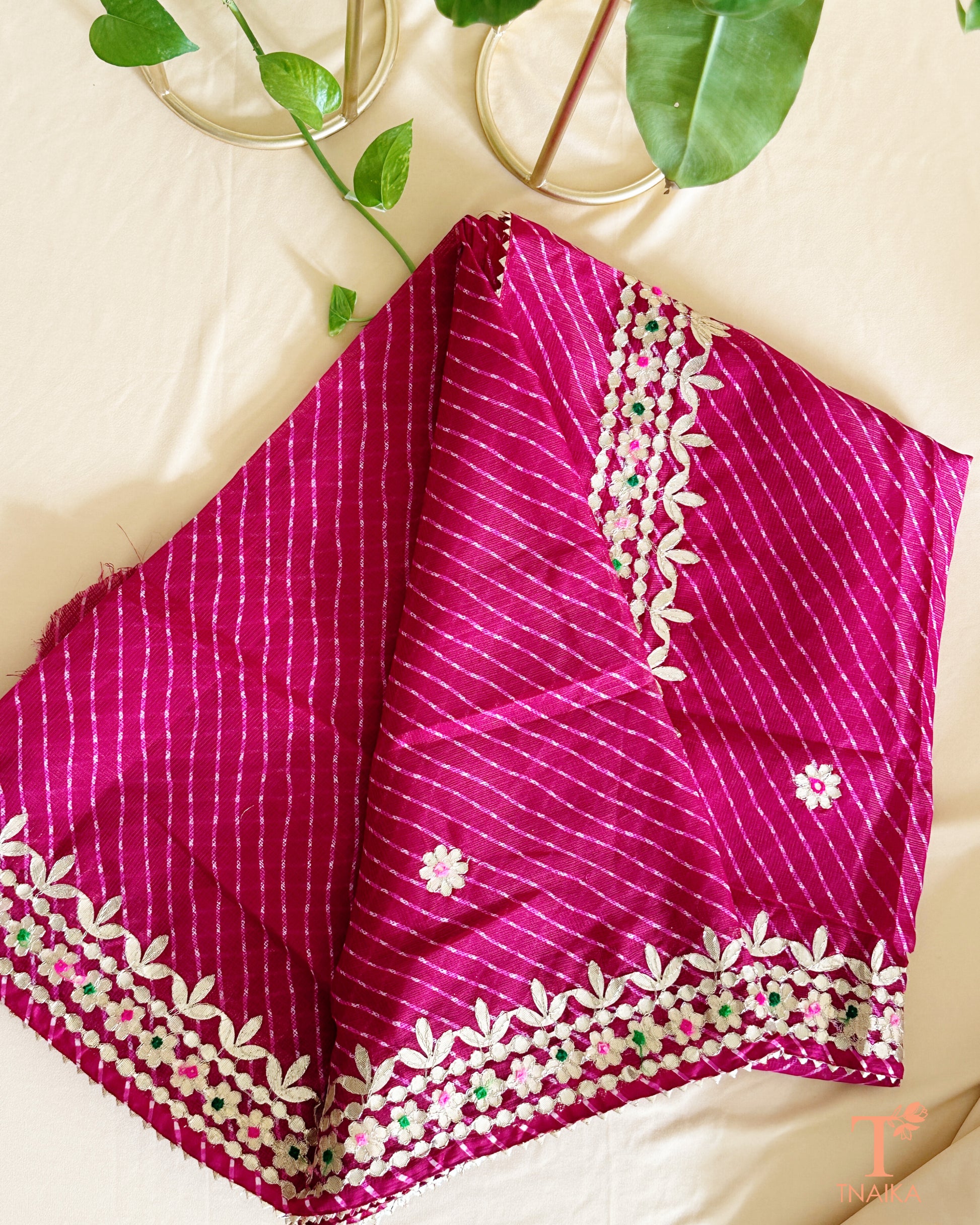  Kota Doria saree adorned with traditional Gotta Patti work and intricate hand detailing.