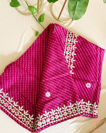  Kota Doria saree adorned with traditional Gotta Patti work and intricate hand detailing.