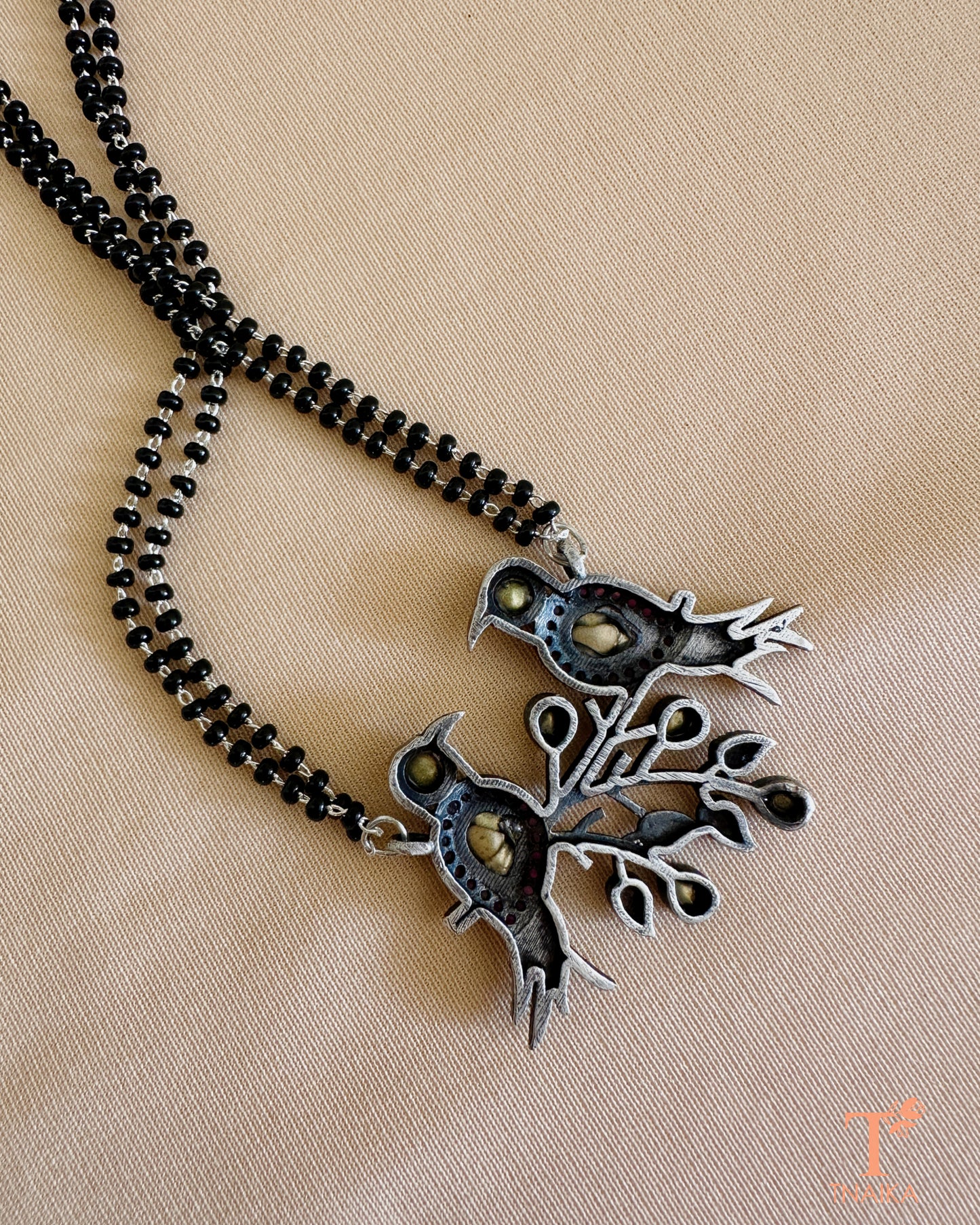 Elegant oxidised stone mangalsutra with handcrafted bird charm for women