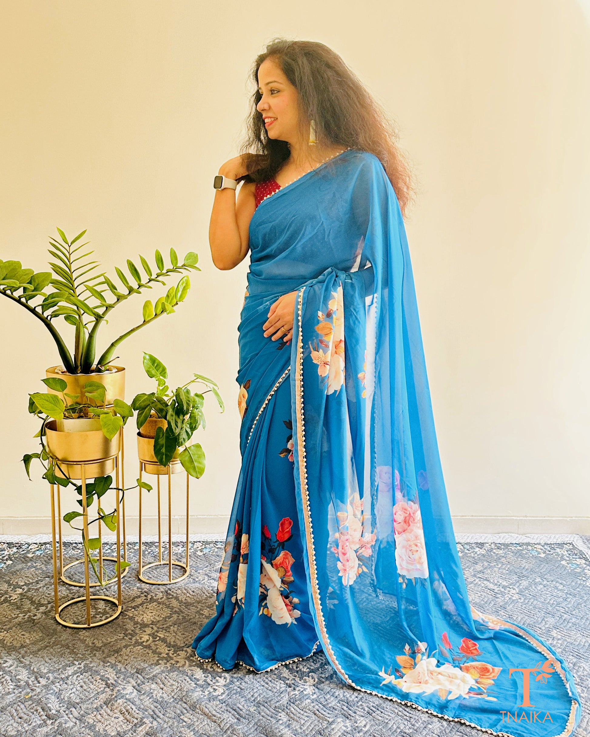 Georgette floral saree with delicate pearl lace border and matching blouse.