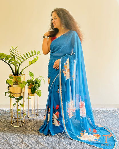 Georgette floral saree with delicate pearl lace border and matching blouse.