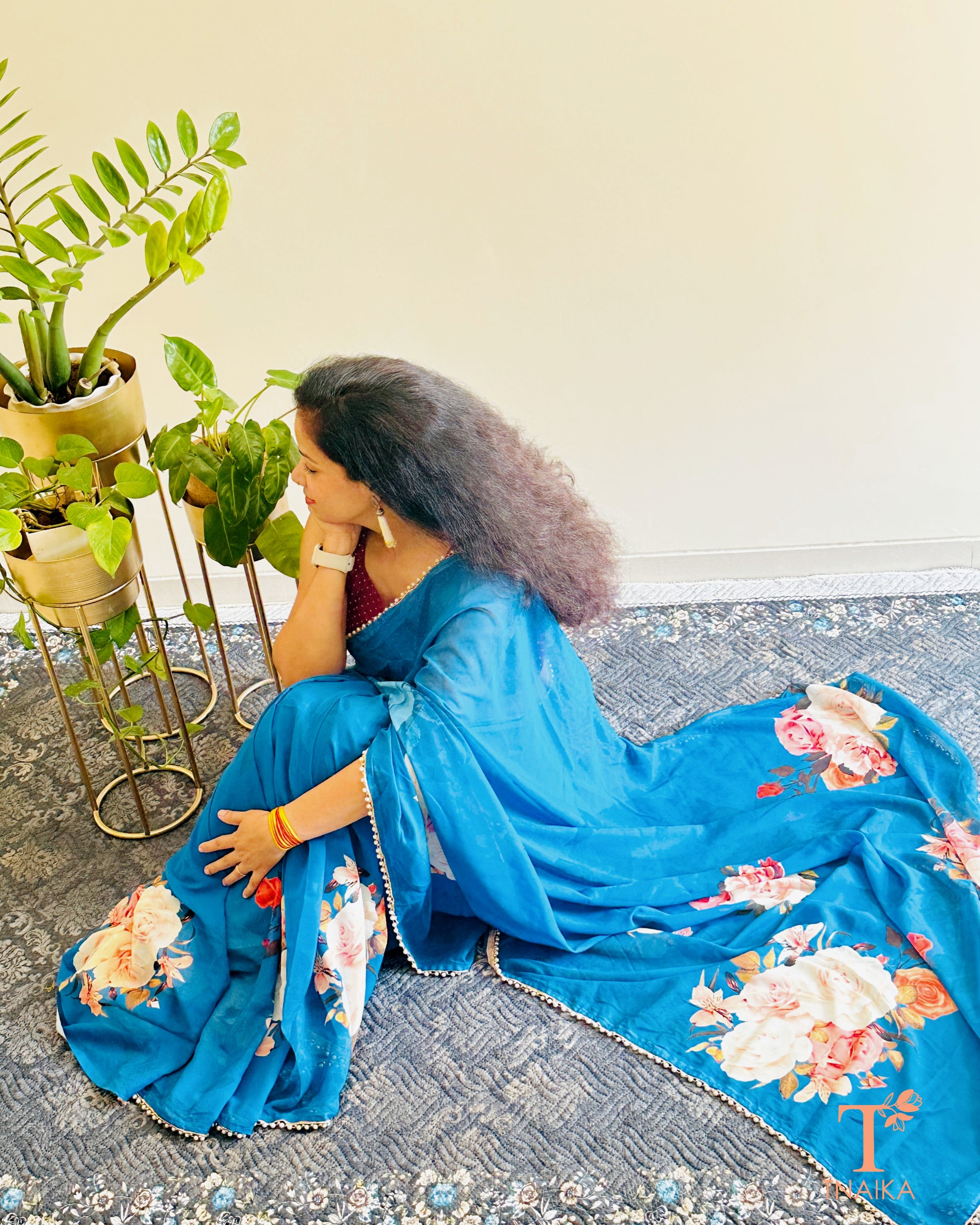 Flowy floral georgette saree paired with a coordinated floral blouse.