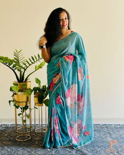 Georgette floral saree with delicate pearl lace border and matching blouse.