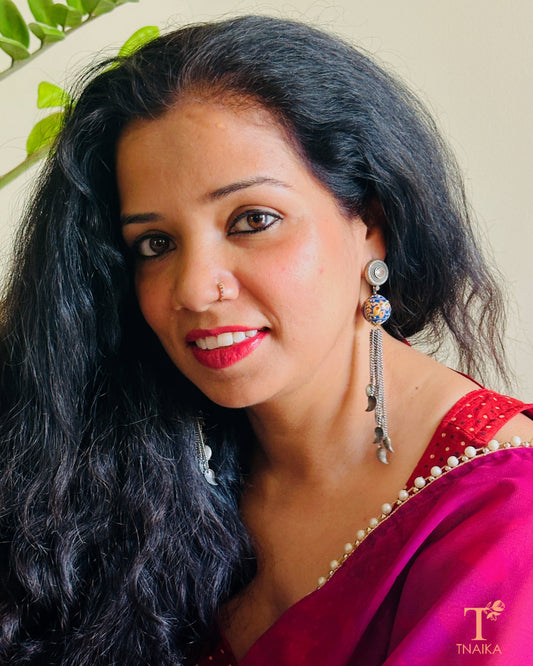 Antique oxidised earrings featuring Meenakari detailing and chain drops