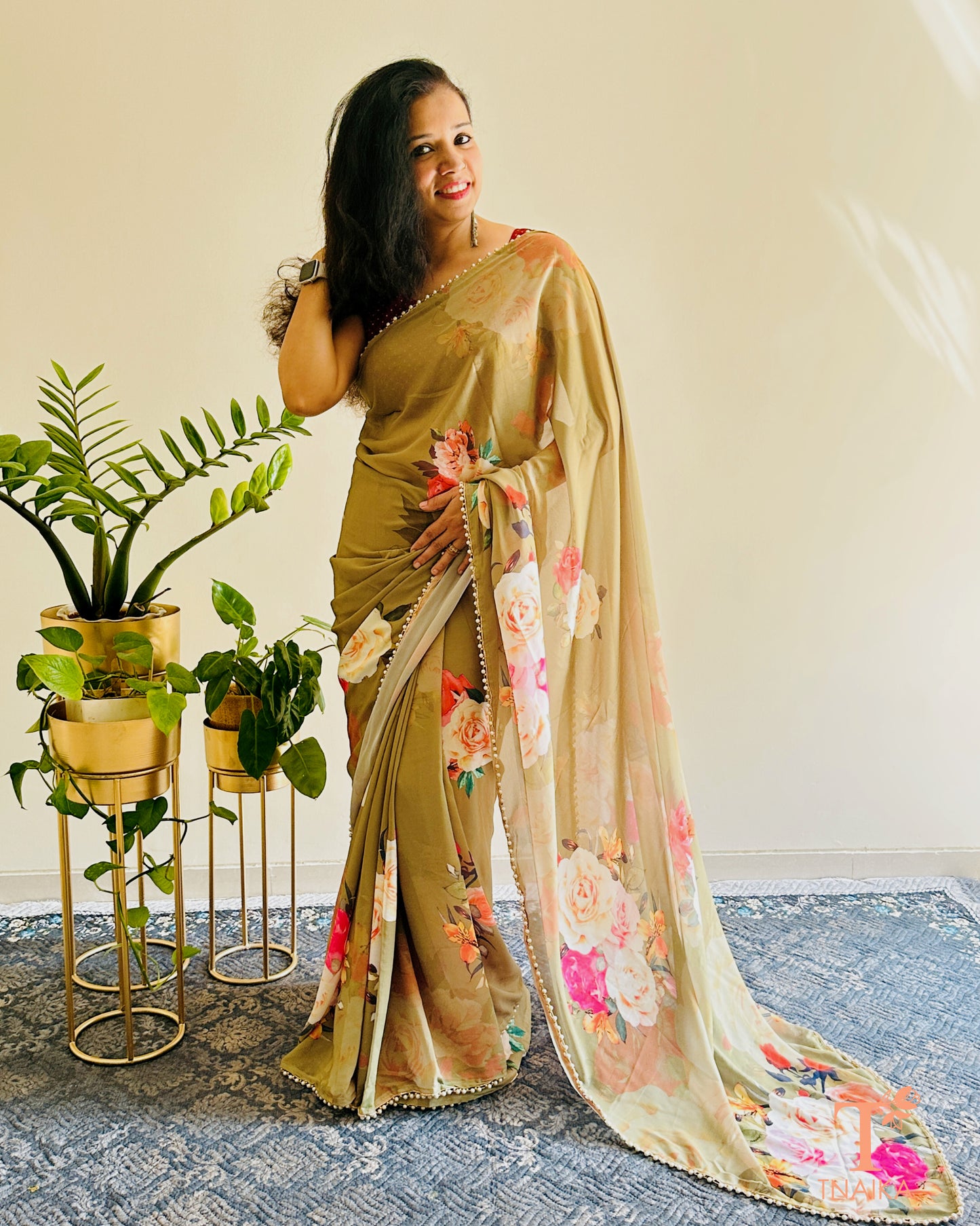 Flowy floral georgette saree paired with a coordinated floral blouse.