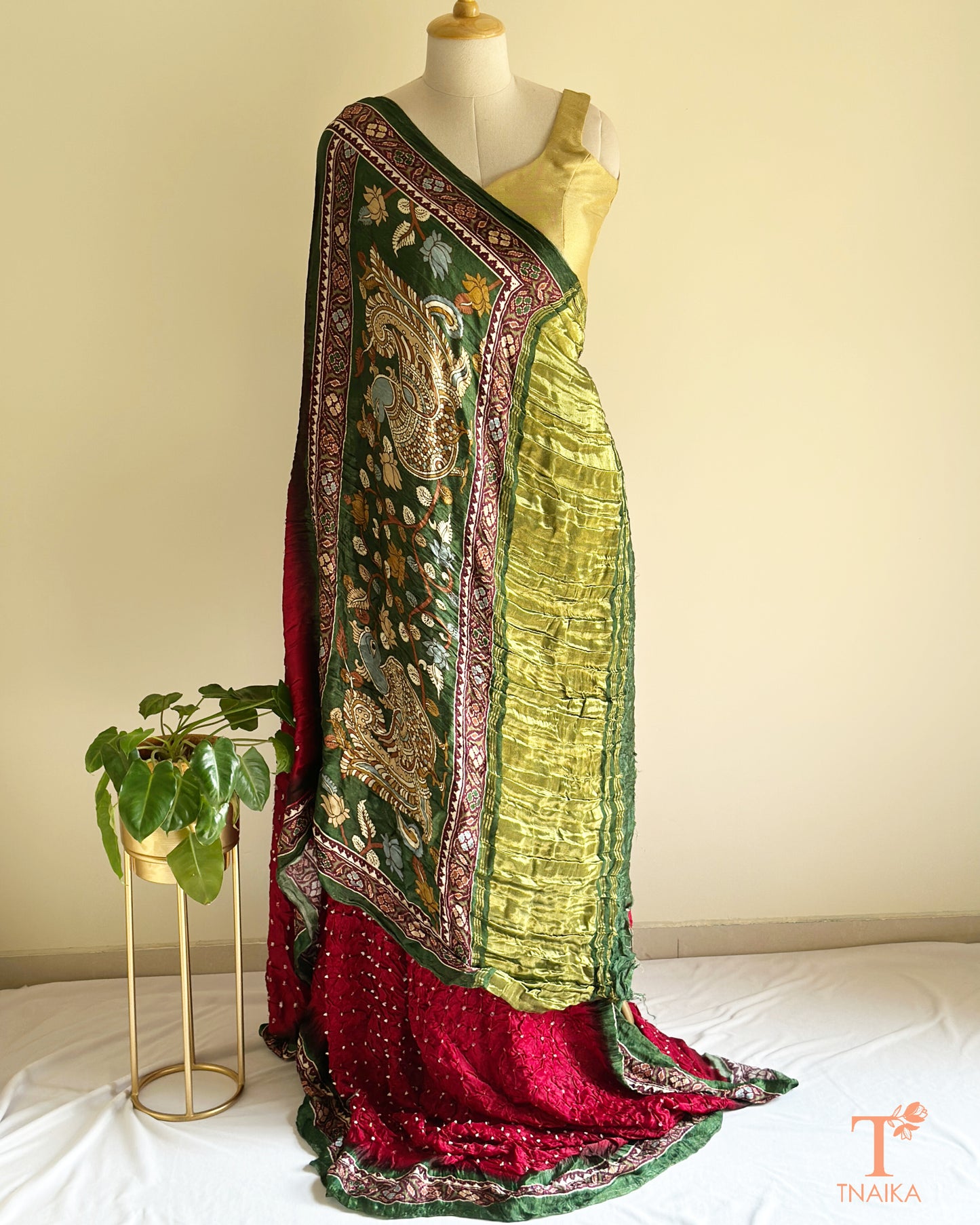Soft modal silk saree with traditional Bandhani base and Kalamkari design pallu