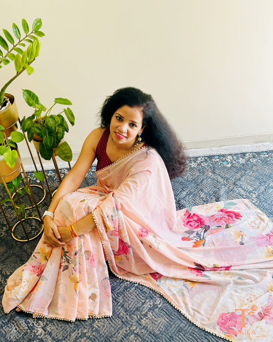 Floral georgette saree with delicate pearl lace border and matching blouse