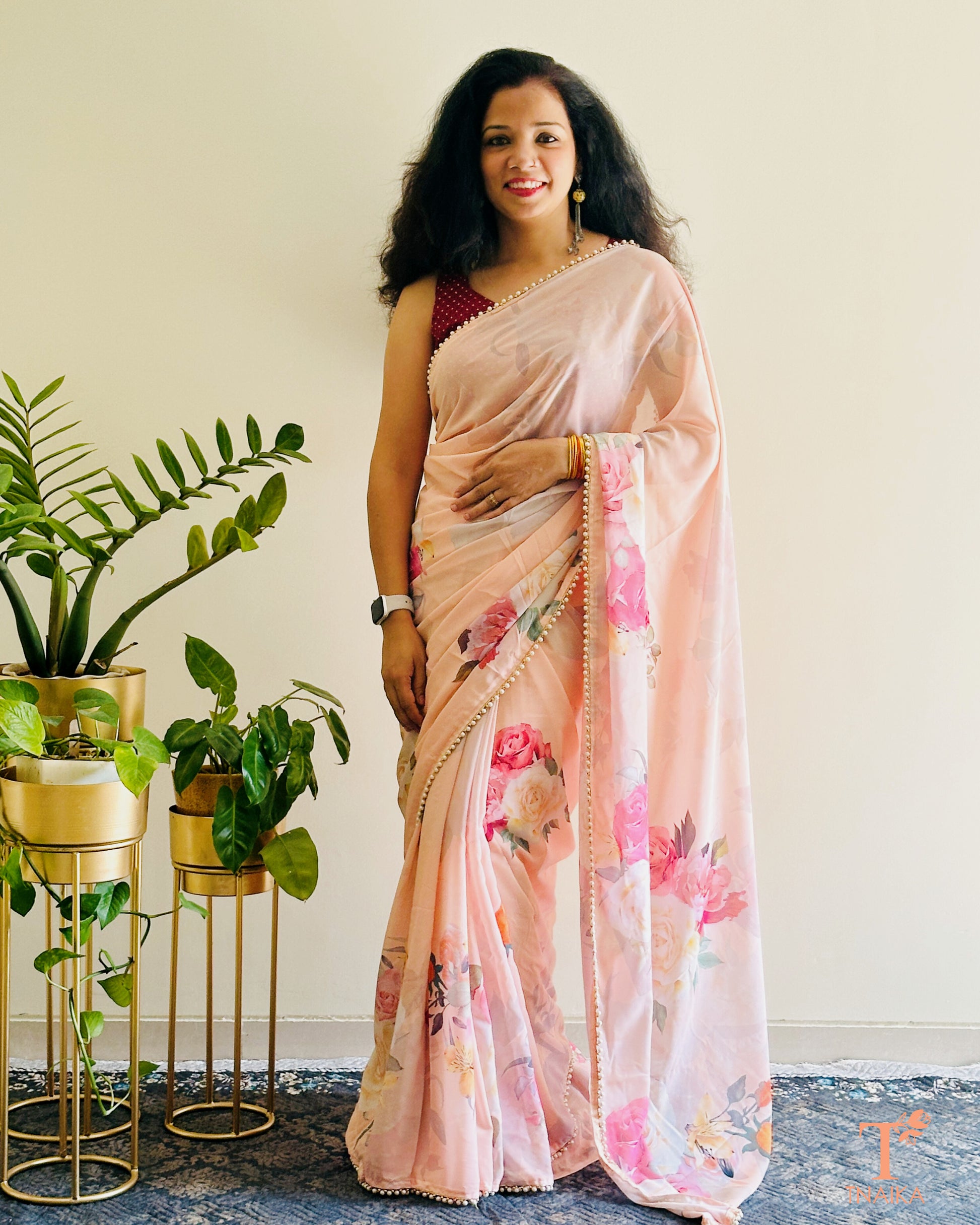 Modern floral printed georgette saree paired with coordinated floral blouse