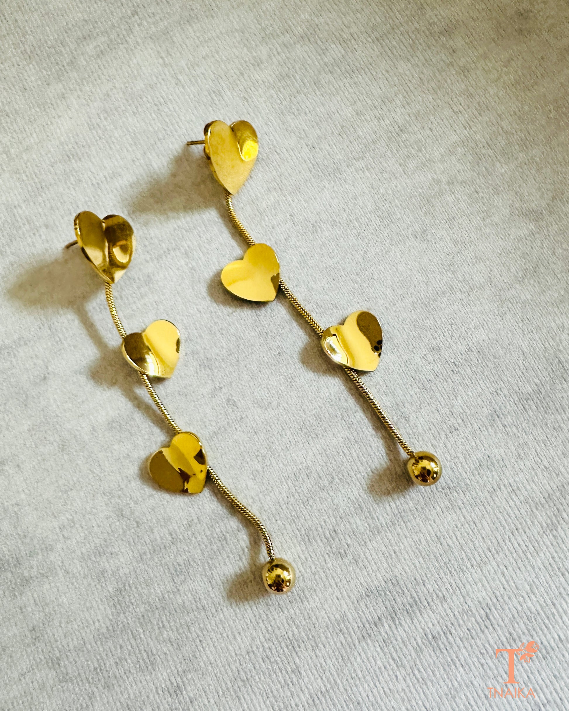 Polished gold heart earrings with flexi chain detail