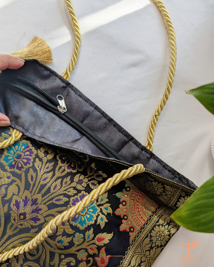 Handcrafted Banarasi bag featuring rich patterns and ethnic detailing