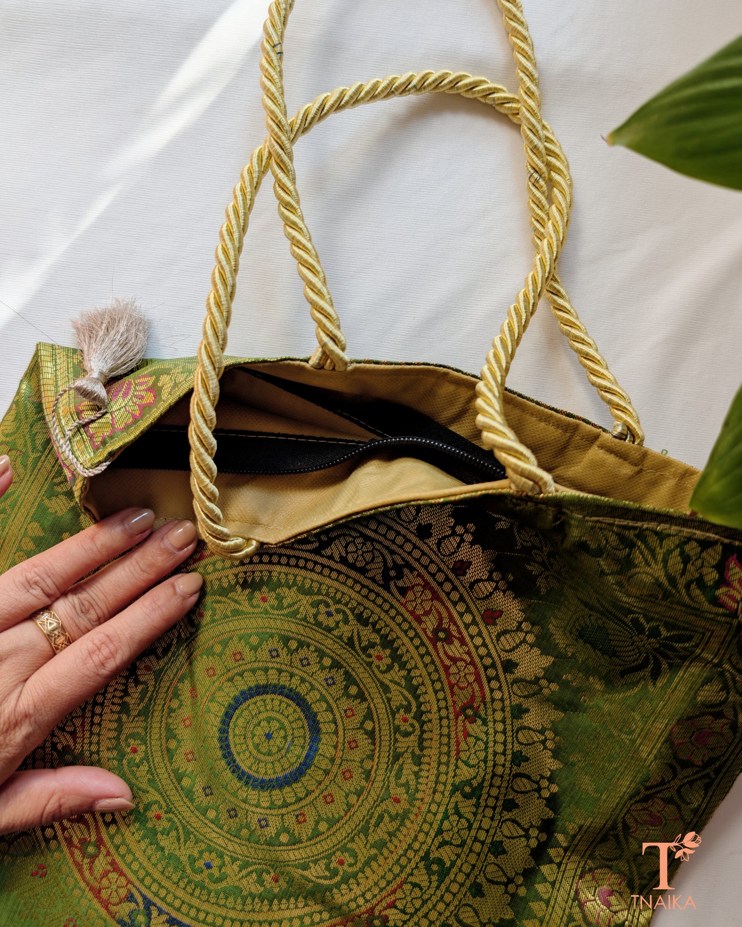 Handcrafted Banarasi bag featuring rich patterns and ethnic detailing