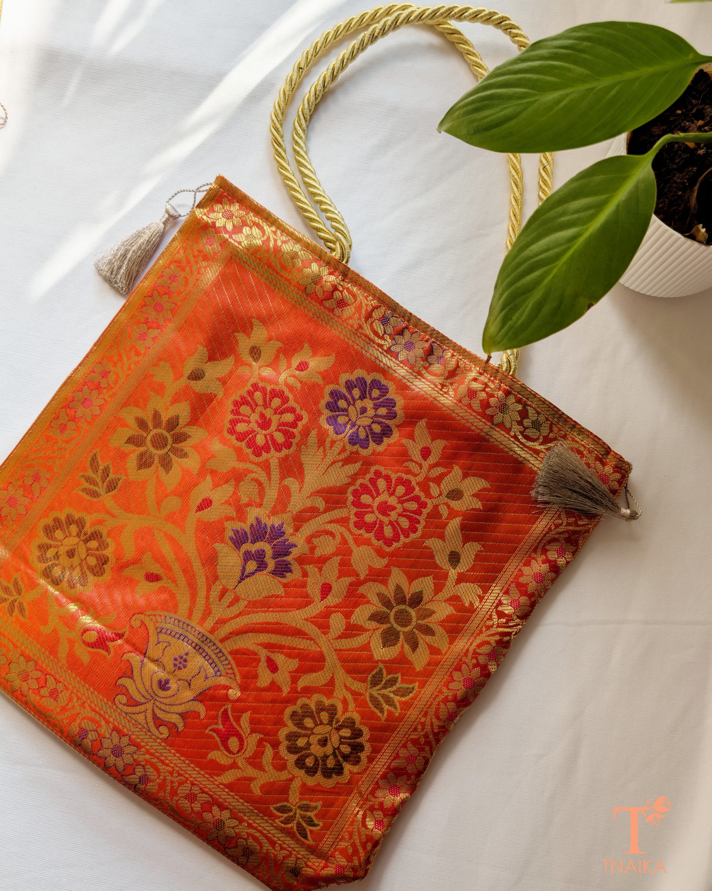 Festive Banarasi purse designed to complement sarees and ethnic outfits