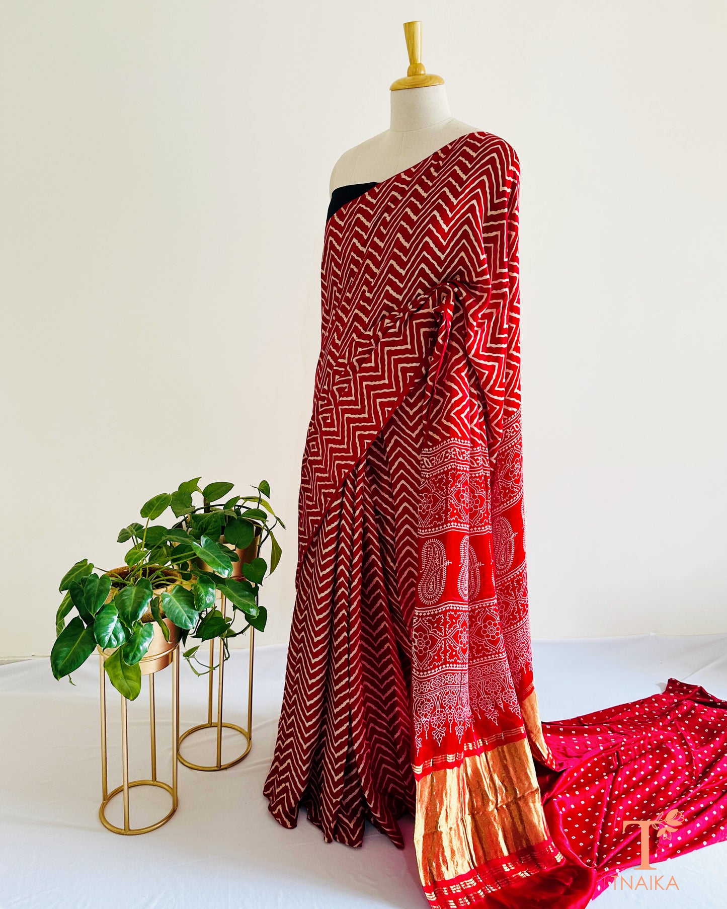 Festive modal silk saree with classic leheriya pattern, tissue lagadi patta-style pallu and Ajrakh accents, includes bandhani running blouse.