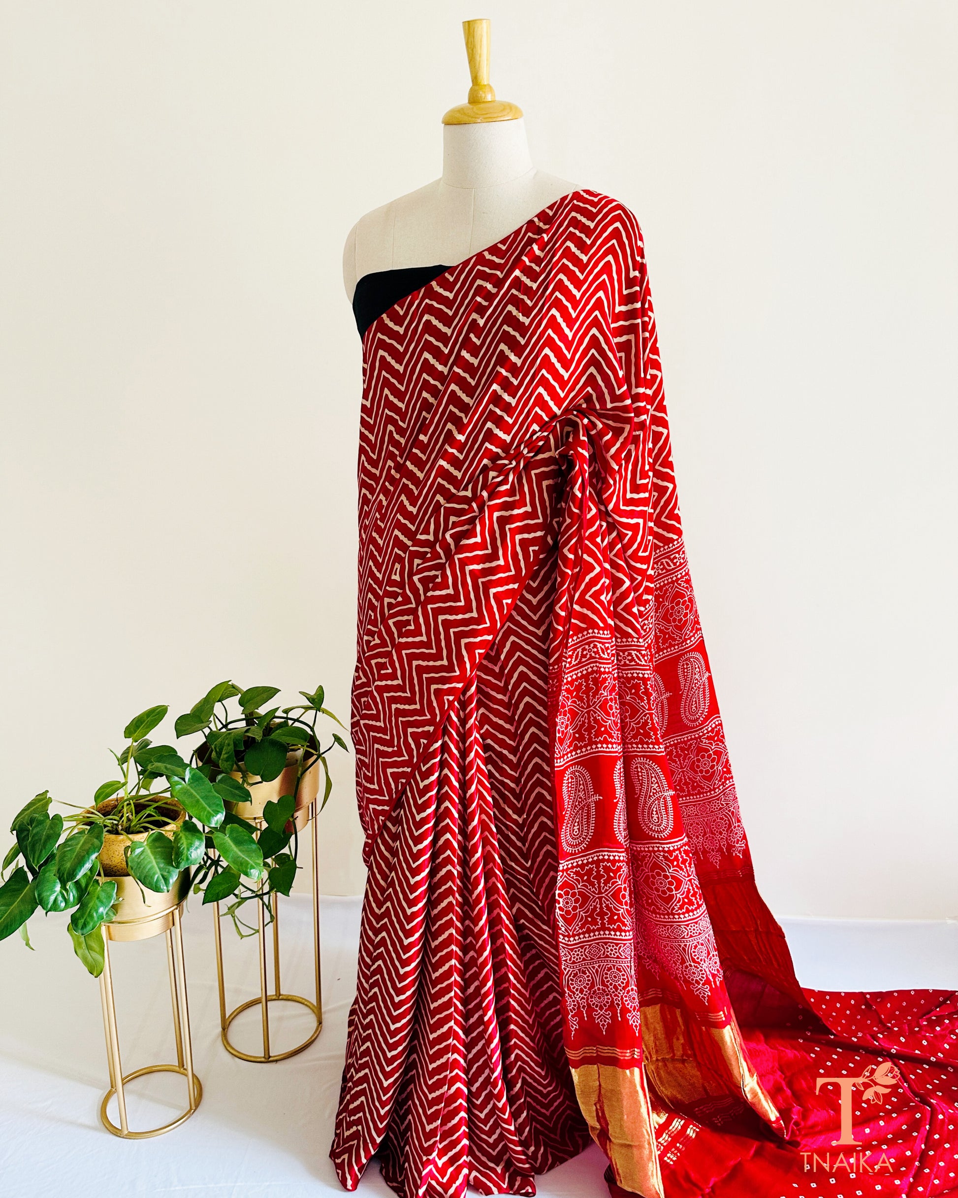 Modal silk leheriya saree with tissue lagadi patta pallu and Ajrakh detailing, paired with unstitched bandhani running blouse.