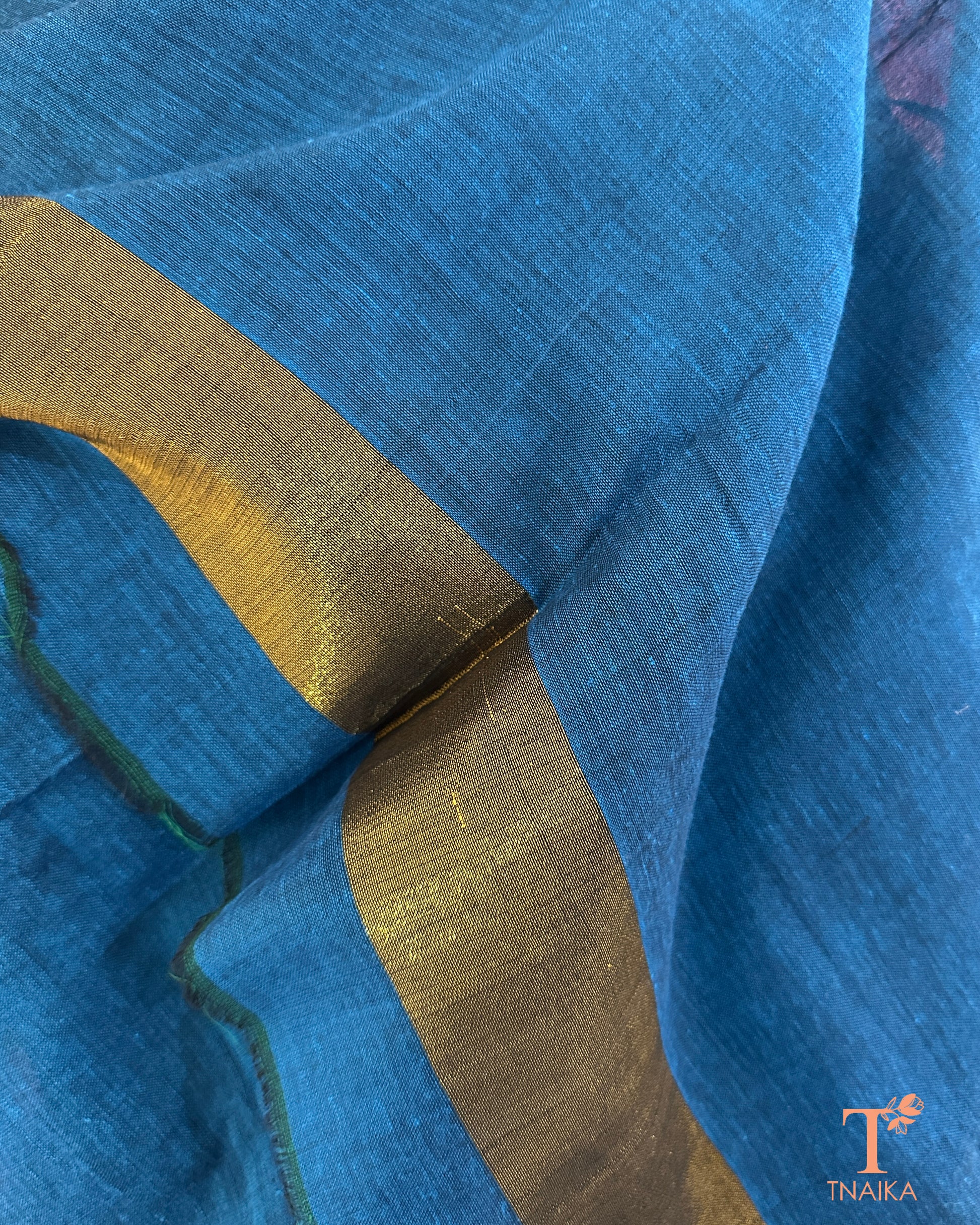 Cotton saree with golden tissue weave pallu and unstitched running blouse.