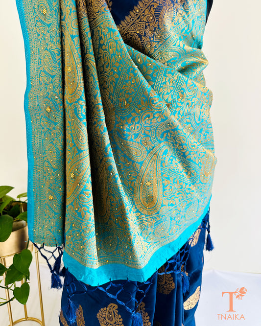 Semi silk saree in royal blue and sky blue with Swarovski stone detailing and elegant traditional drape.