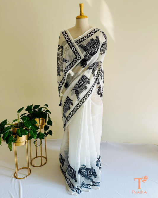 Elegant white saree featuring elephant motif border