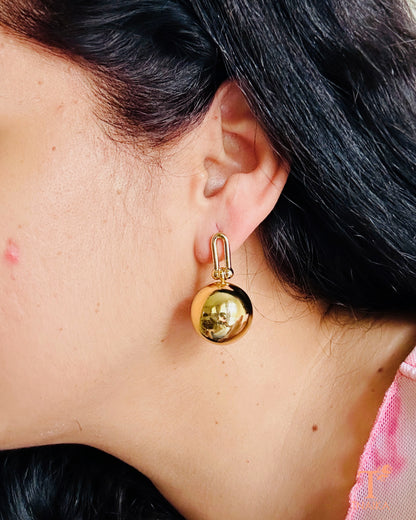 Close-up of anti-tarnish gold finish dangler earring