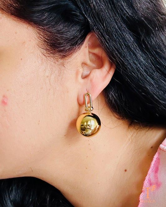 Close-up of anti-tarnish gold finish dangler earring