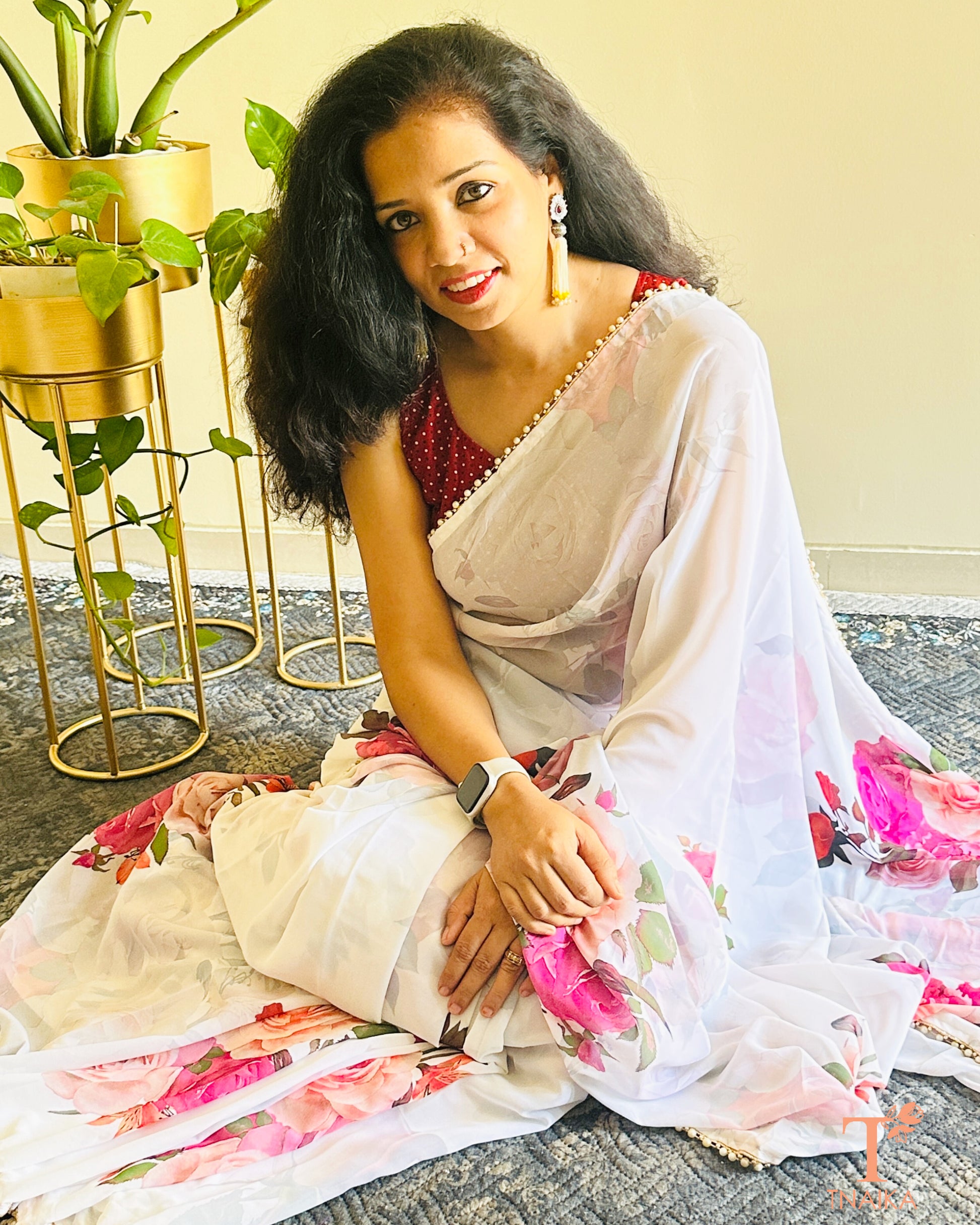 Flowy floral georgette saree paired with a coordinated floral blouse.