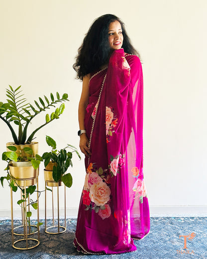 Flowy floral georgette saree paired with a coordinated floral blouse.