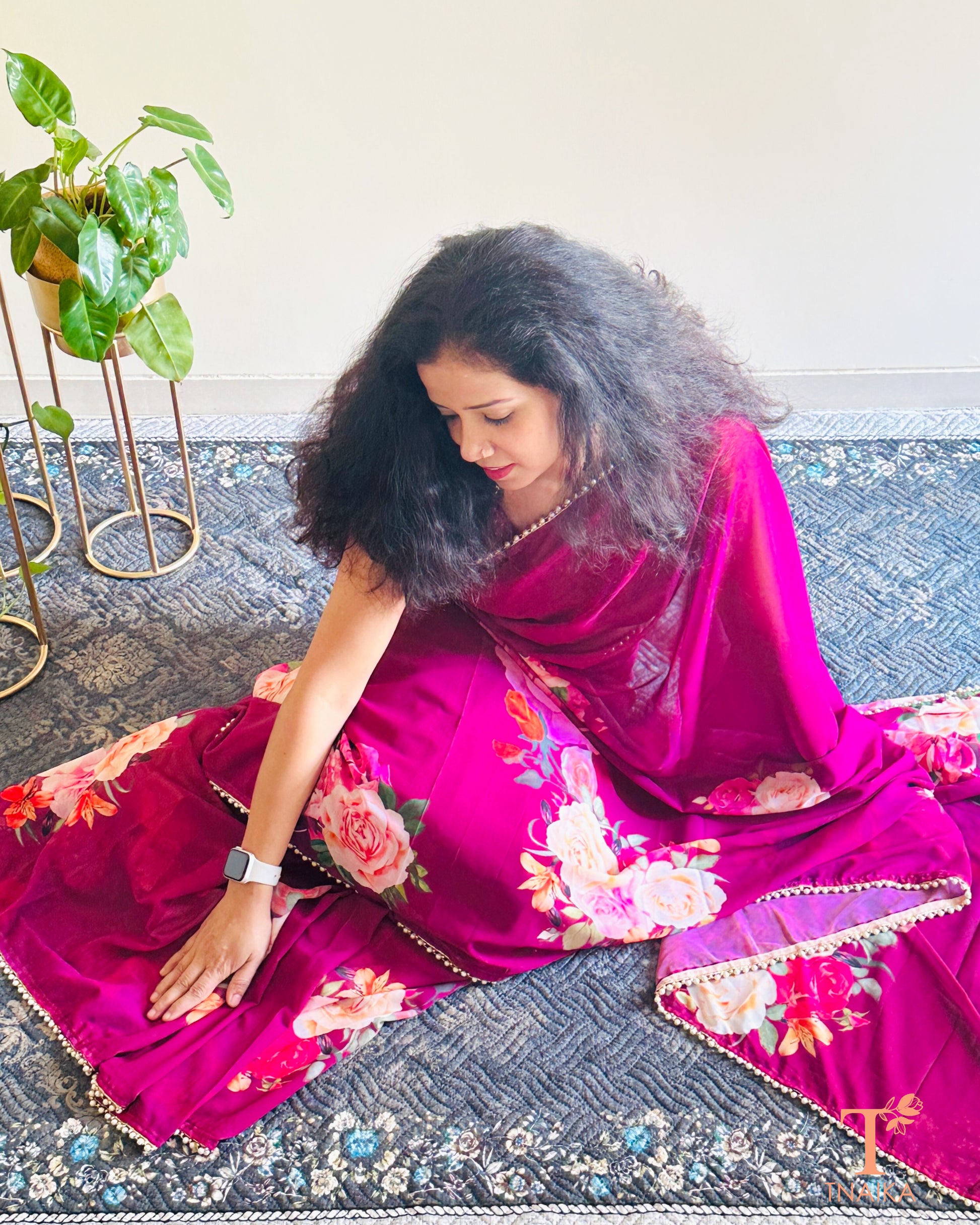 Lightweight floral georgette saree featuring pearl lace detailing for festive wear.