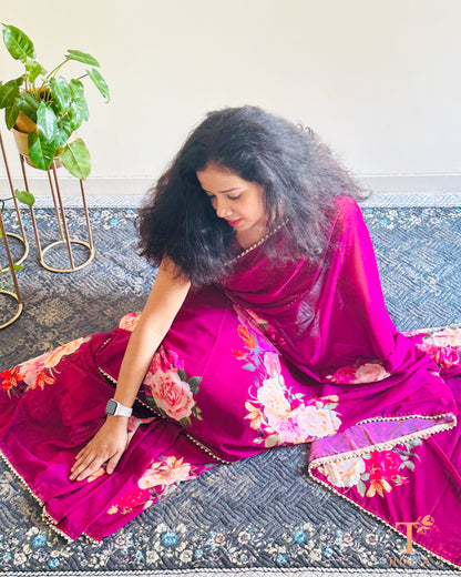 Lightweight floral georgette saree featuring pearl lace detailing for festive wear.