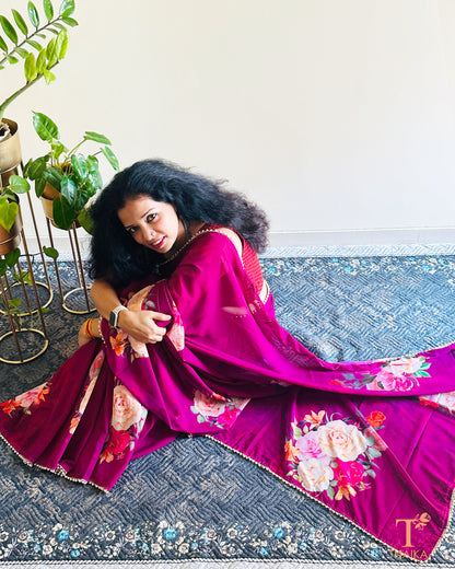 Soft georgette saree with floral prints and elegant pearl lace finish.