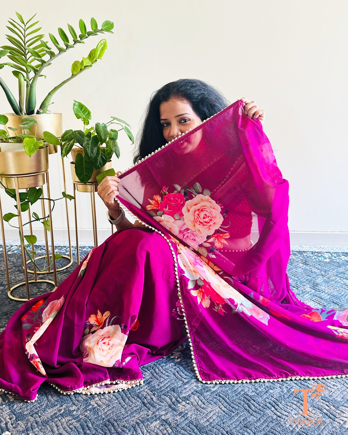 Flowy floral georgette saree paired with a coordinated floral blouse.