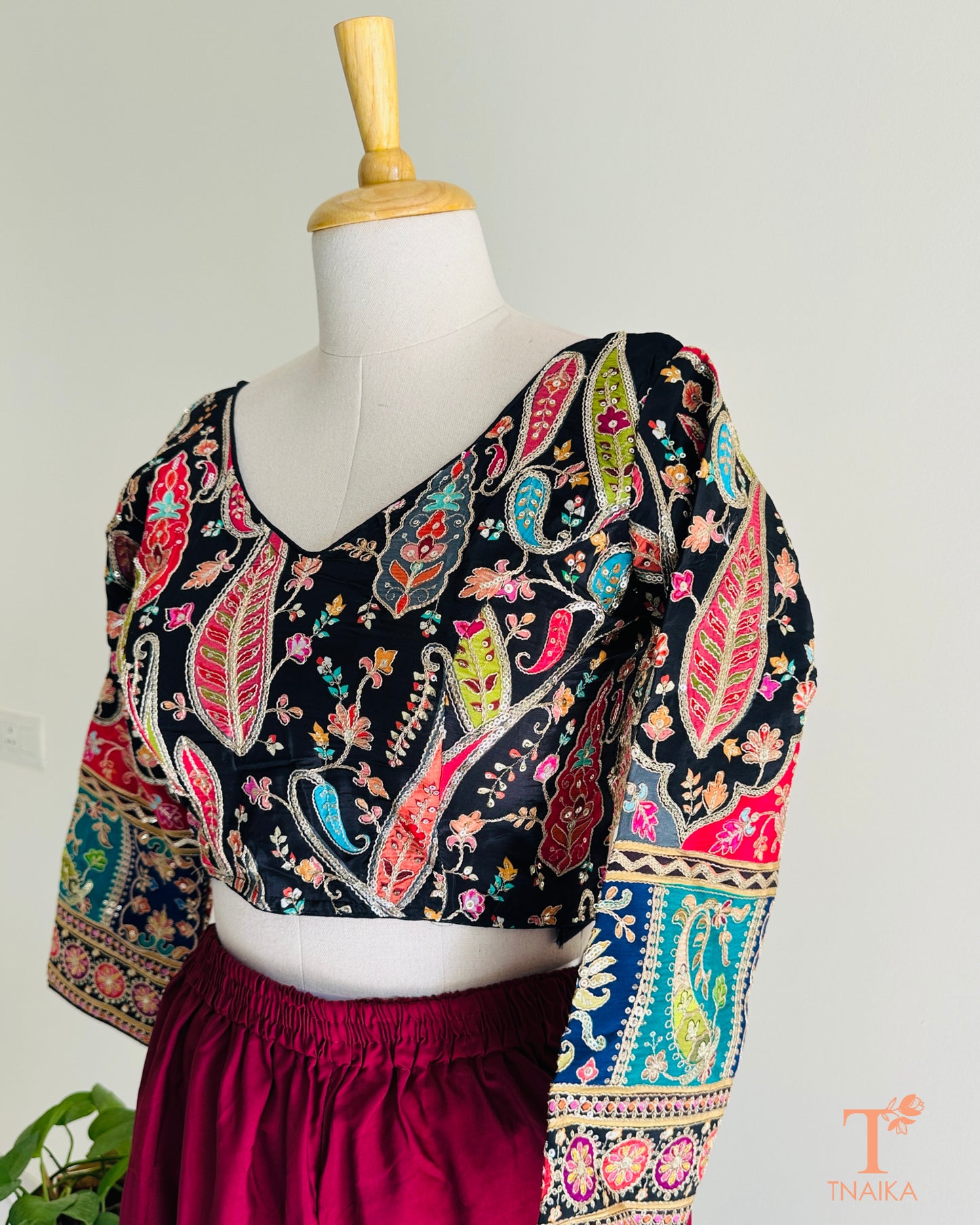 Premium pure crepe blouse featuring delicate embroidery and a smooth fluid finish for an effortless festive look.