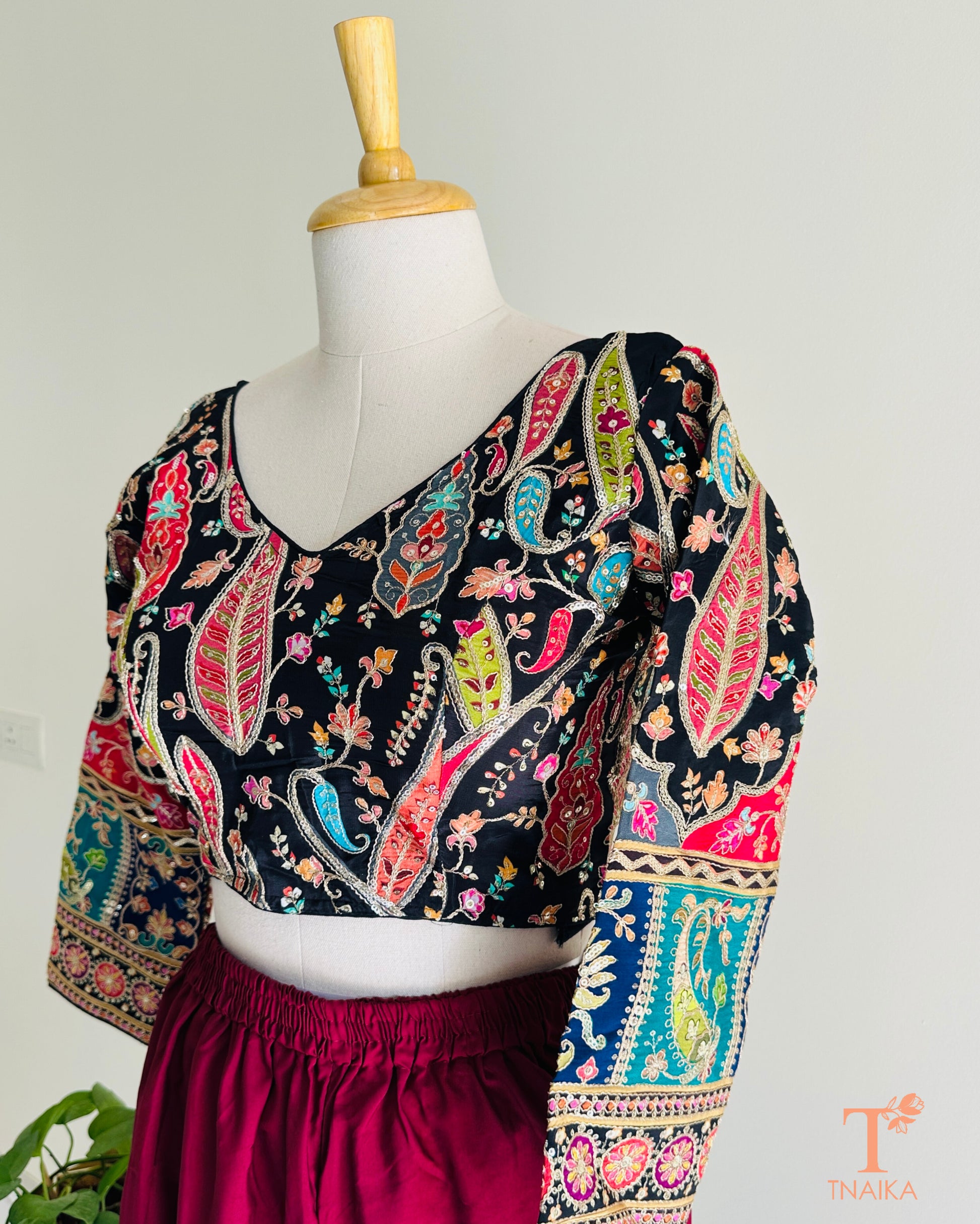 Premium pure crepe blouse featuring delicate embroidery and a smooth fluid finish for an effortless festive look.