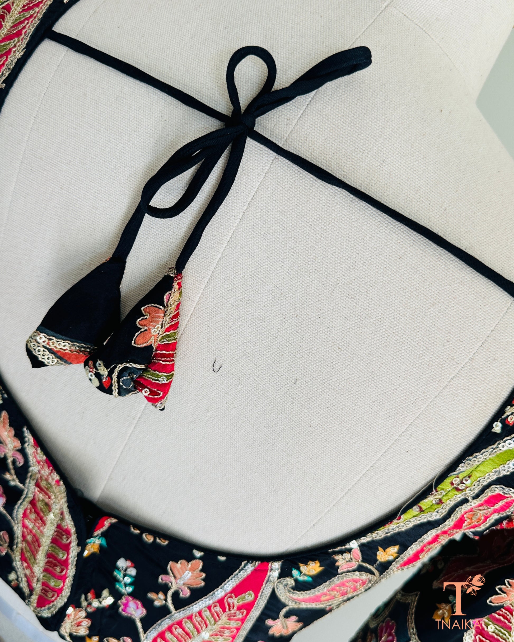 Elegant pure crepe blouse with fine embroidery work, soft feel and comfortable fit for traditional outfits.