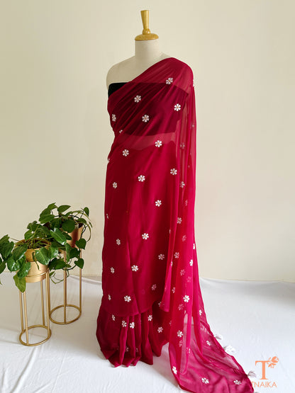 Georgette saree featuring Parijat floral motifs with blouse fabric