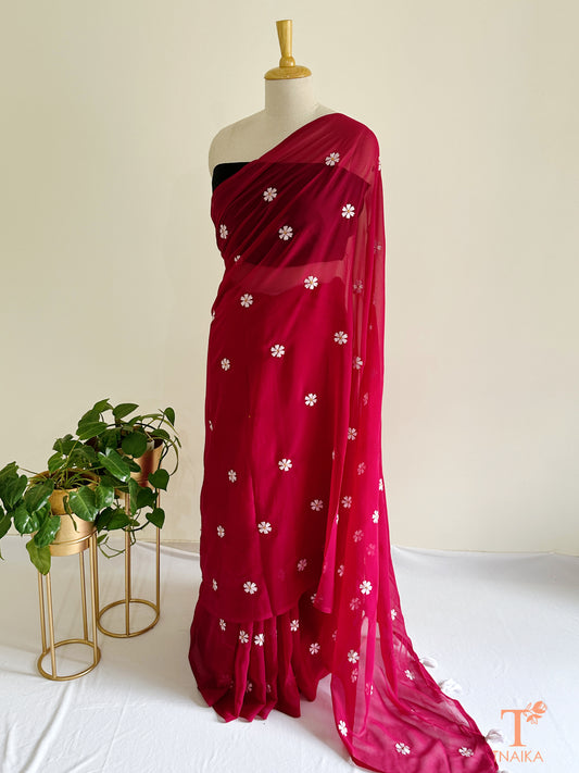 Georgette saree featuring Parijat floral motifs with blouse fabric