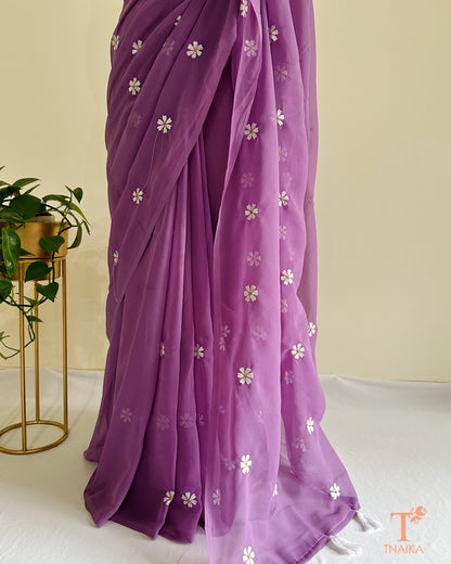 Georgette saree featuring Parijat floral motifs with blouse fabric
