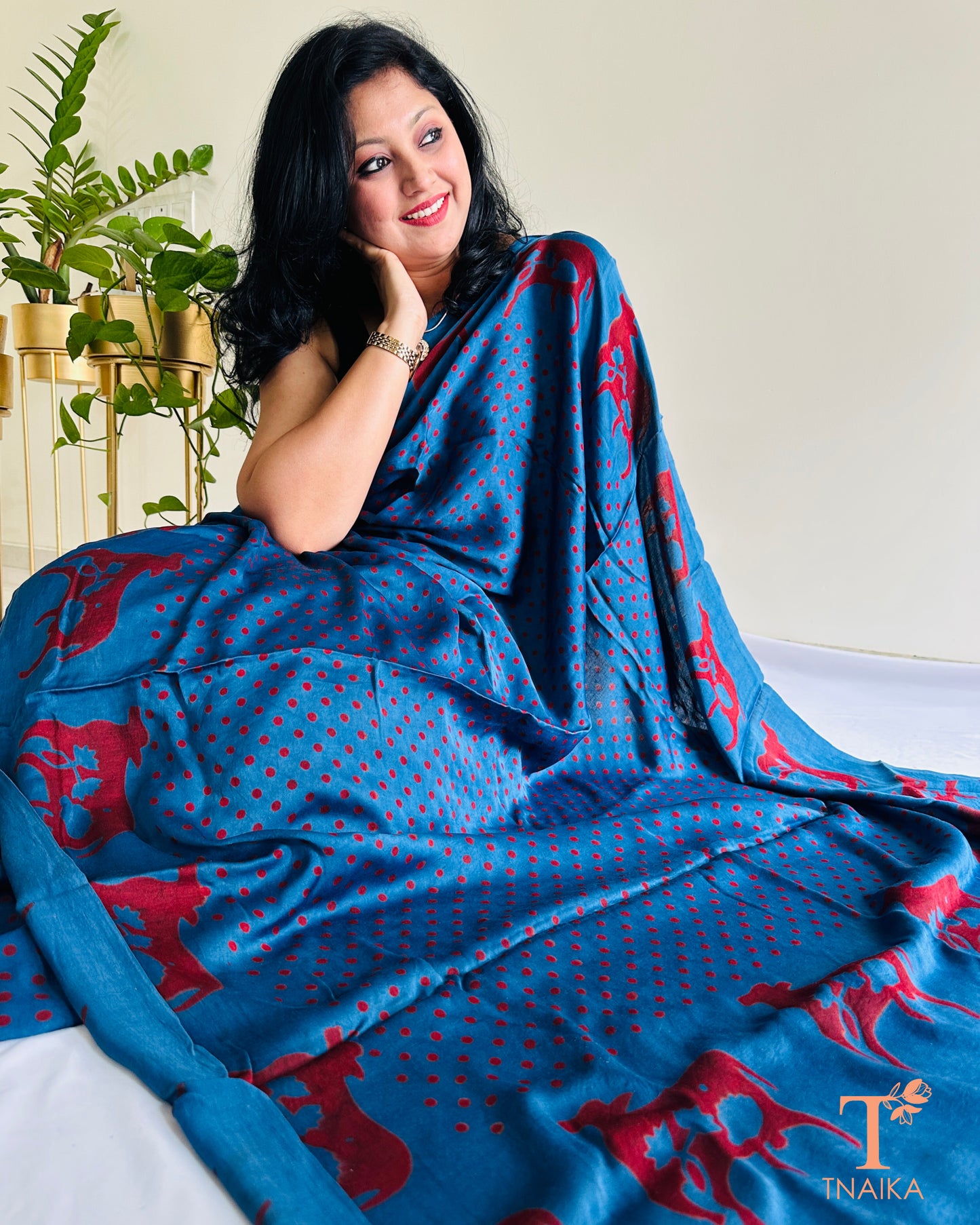 Lightweight blue modal silk saree with cultural cow design