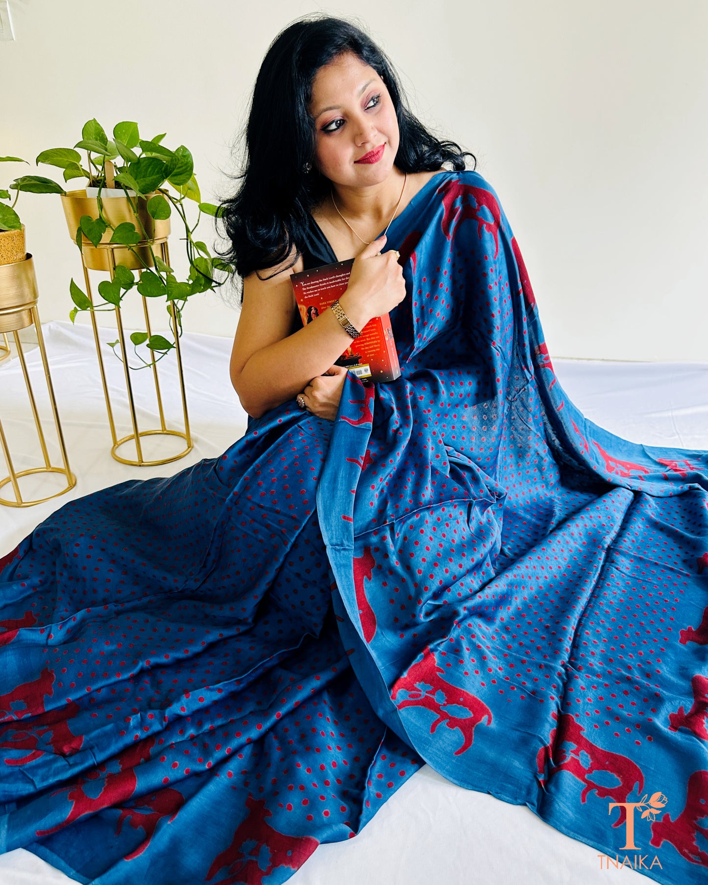 Heritage-inspired modal silk saree with symbolic cow border