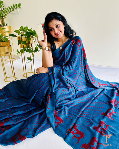 Traditional Indian cow motif saree in blue and red tones