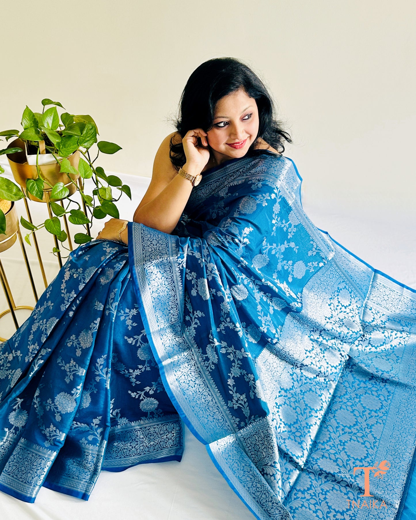 Peacock blue Banarasi silk saree with silver zari floral weave