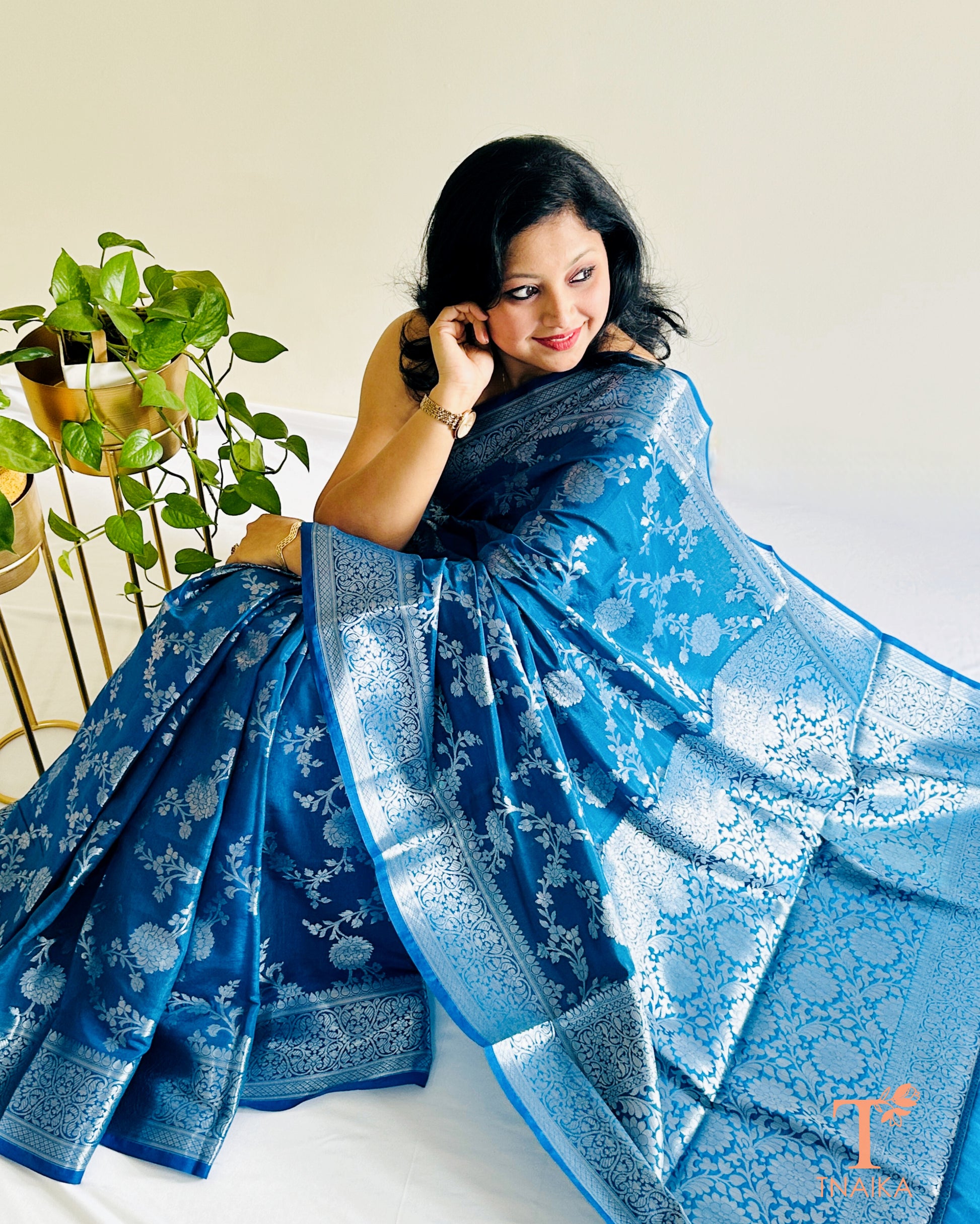 Peacock blue Banarasi silk saree with silver zari floral weave