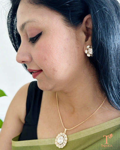 Polki pendant chain set with matching stud earrings in an elegant traditional design.