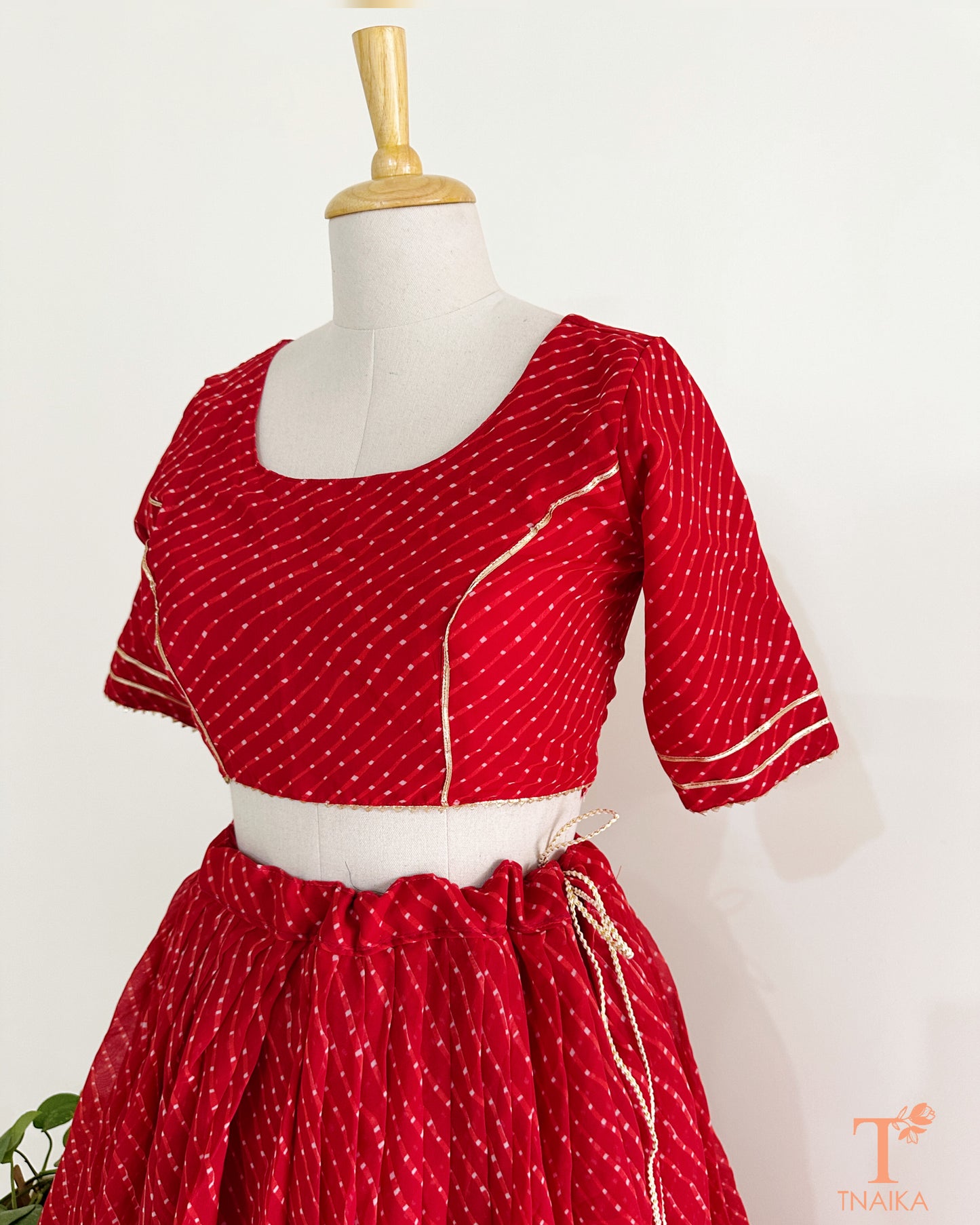 Traditional Leheriya lehenga set in soft georgette fabric with lace accents for an elegant ethnic look