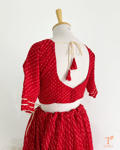 Vibrant Leheriya georgette lehenga featuring lace detailing, ideal for weddings and festive occasions