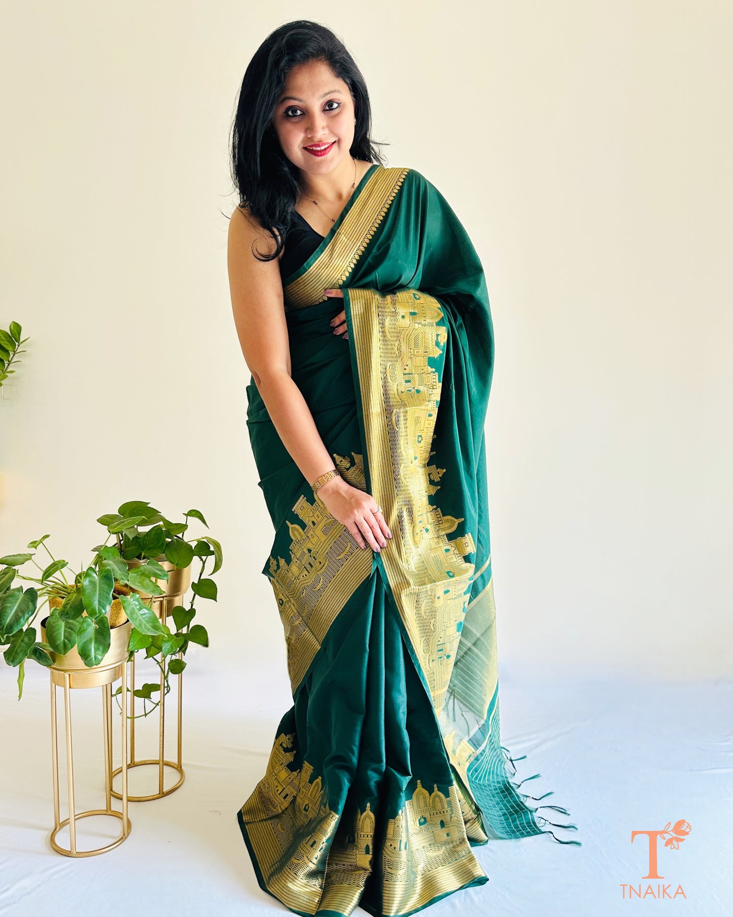 emerald green crepe silk saree with grand zari border